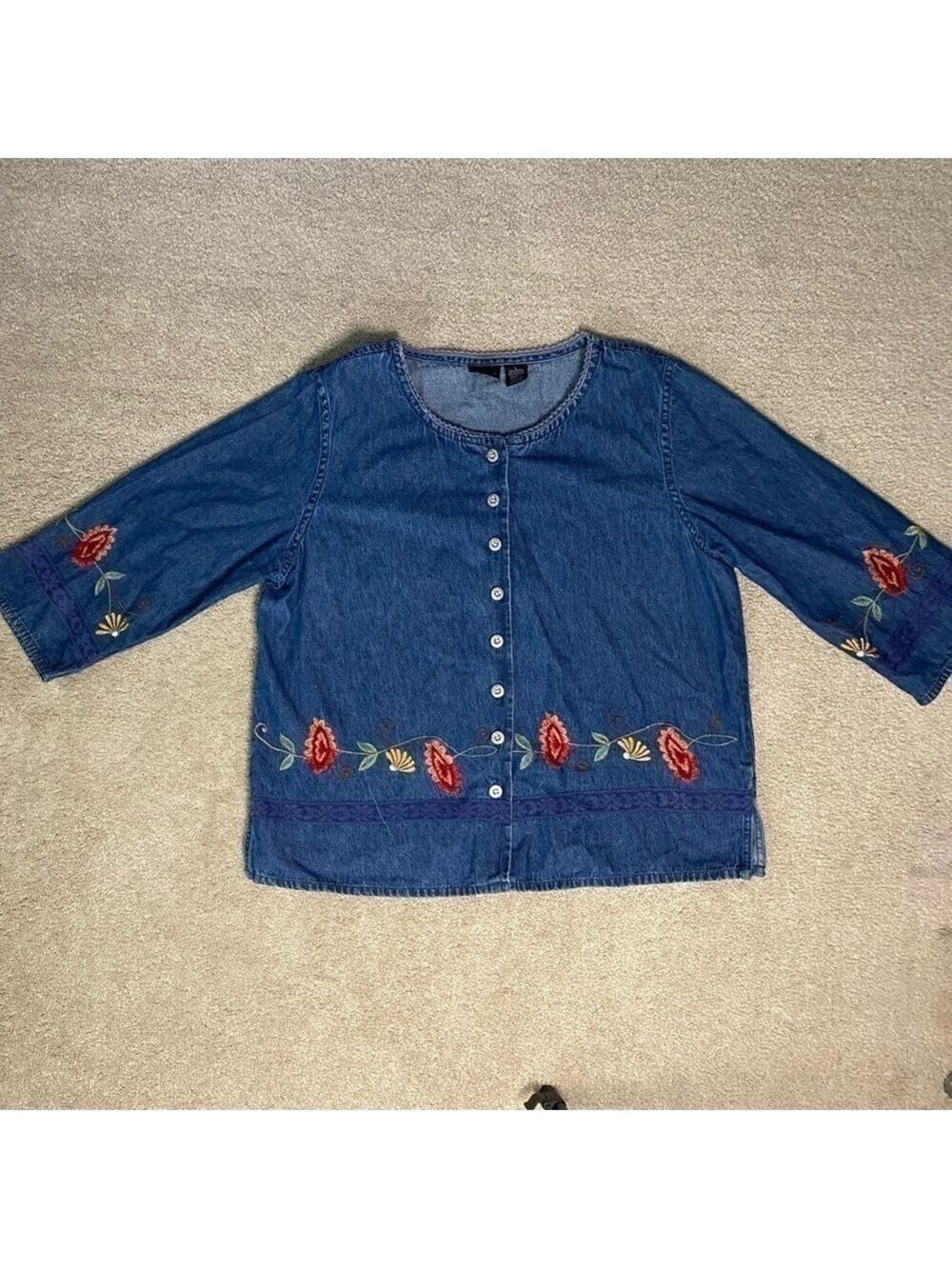 Jean jacket- made by Erika, made in India. Decoratively with hand broiled flower